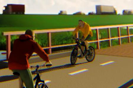 Fietsers op fietsbrug langs snelweg